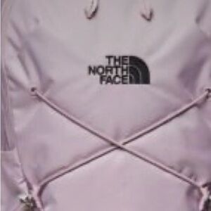 one size north face deep purple back pack
